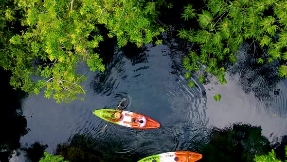 Couple in Kayak in the Jungle of Krabi Thailand Men and Woman in Kayak at a Tropical Jungle in Krabi