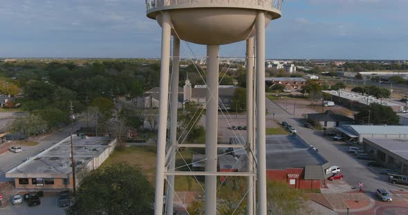 Establishing aerial shot of large water tank in downtown Katy, Texas just outside of Houston.