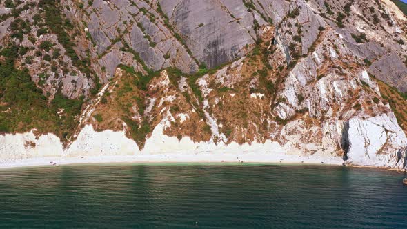 Aerial View of White Beachrocky Cliffsblue Sea Deep White Cliffs