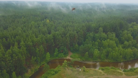 Newly Wedded Couple on Riverbank on Nasty Day Bird Eye View