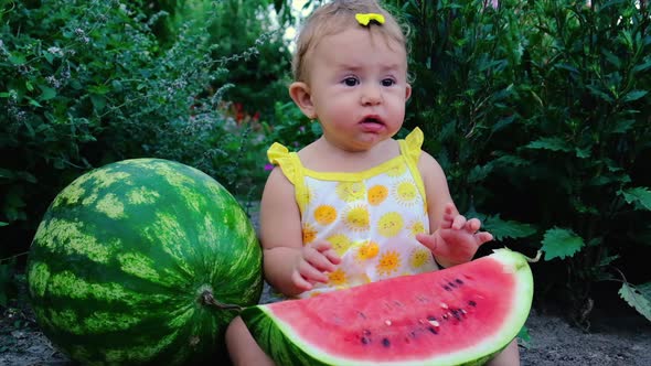 Child Girl Eats Watermelon in Summer