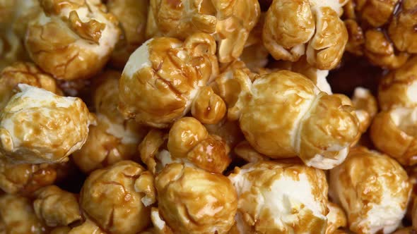 Coffee taste popcorns rotating close up. Caramel popcorn. Healthy food for morning breakfast