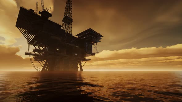 Offshore Jack Up Rig in The Middle of The Sea at Sunset Time