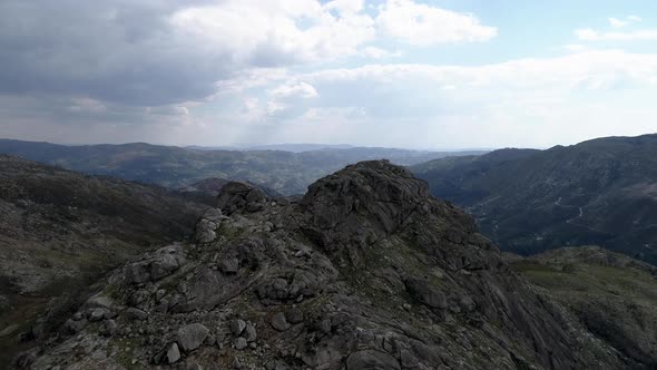 Drone Flying Over Mountain Tops into Thick