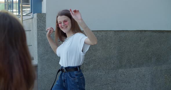 Happy Stylish Female Teens Dancing on Leisure