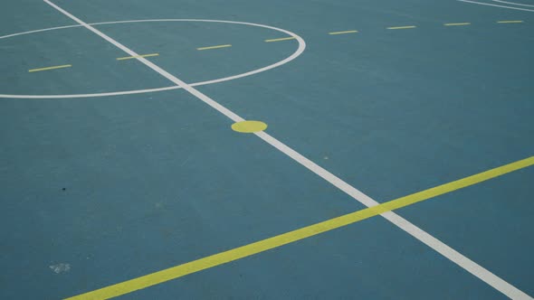 Markings on the ground of an outdoor court in sport center
