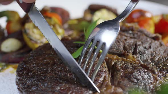 Cutting Beefsteak with Fork and Knife