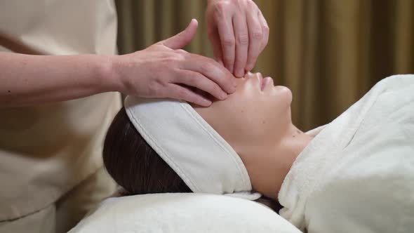 Woman's Eyebrows Are Massaged