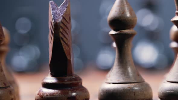 Dolly Shot of Old Vintage Chess Pieces on Wooden Chessboard