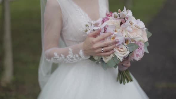 Wedding Bouquet in the Hands of the Bride. Wedding Day. Engagement