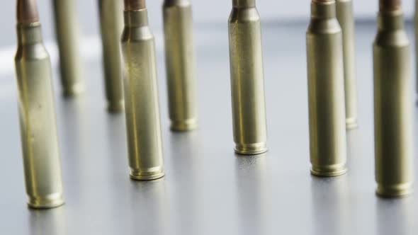 Cinematic rotating shot of bullets on a metallic surface - BULLETS 063