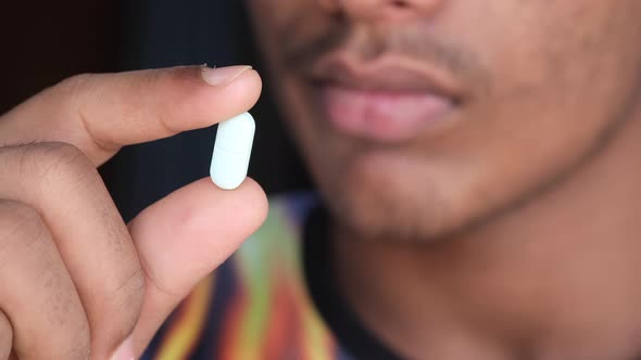 Close Up of Man Hand Holding Pills with Copy Space