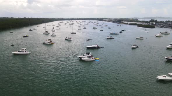 Vacation Boats and Yachts in Ocean on Miami, Florida Coast - Aerial Flight