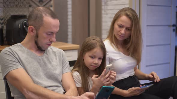 Parents with a Child in the Kitchen