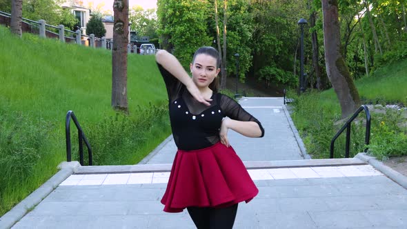 Stunning female turns and smiles while dancing