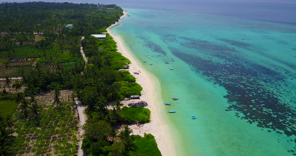 Tropical aerial clean view of a summer white paradise sand beach and blue sea background 