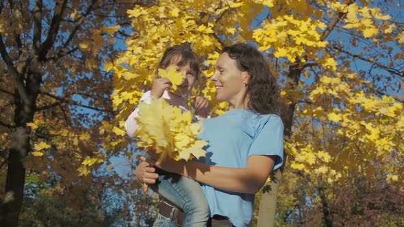 Happy Family in the Fall in Nature