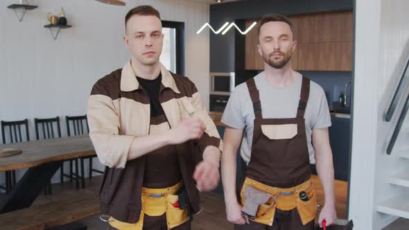 Contractors in Uniform Posing in House