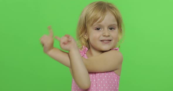 Pretty Child Emotionally Makes Faces and Smile in Pink Swimsuit. Chroma Key