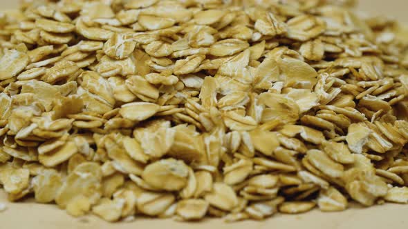 Spinning Oatmeal Close-up. Concept of Healthy Nutrition and Production of Natural Products