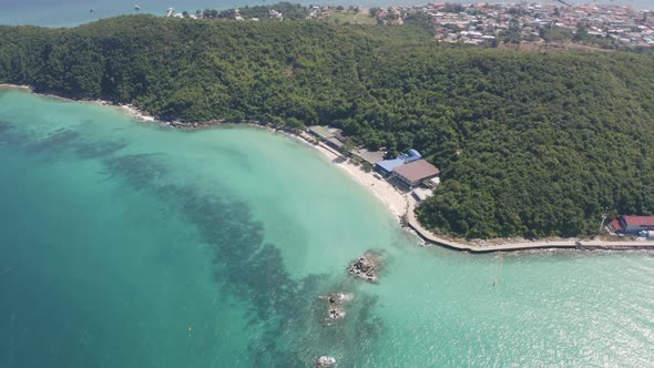 Aerial view of Koh Larn beach, Pattaya with blue turquoise seawater, mountain hills