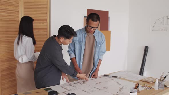 Architects Working on Housing Project in Office