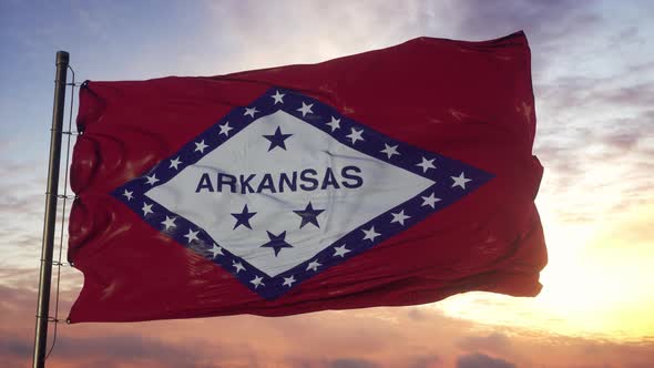 Flag of Arkansas Waving in the Wind Against Deep Beautiful Sky at Sunset