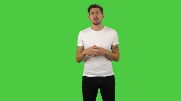 Confident Guy Is Reporting and Telling a Lot of Interesting Information. Green Screen