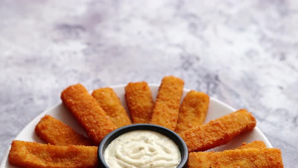 Crumbed Fish Sticks Served with Garlic Dip Sauce