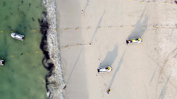 Amazing Aerial Downward View of Beautiful Tropical Beach with Tourists