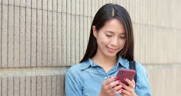 Woman Use of Mobile Phone in City