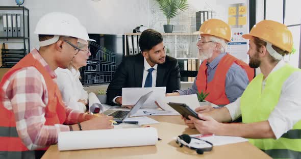 Main Engineer Discussing Working Questions Together with Professional Diverse Male and Female Team