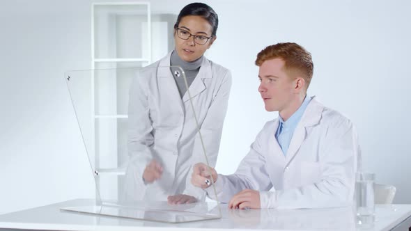 Two Doctors Using Transparent AR Screen