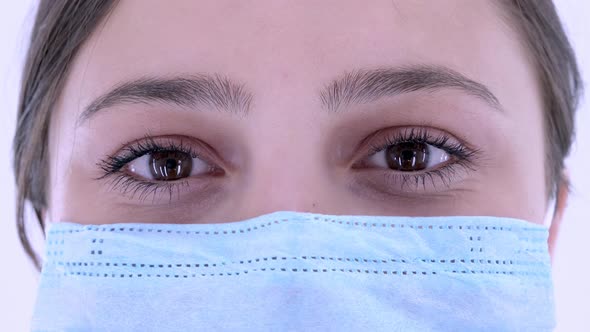 Close up. Woman in face mask for virus infection prevention and protection.