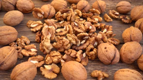 Walnut kernels are falling on the old wooden vintage board