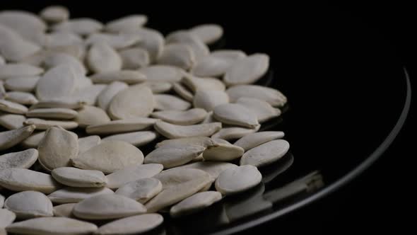 Cinematic, rotating shot of pumpking seeds - PUMPKIN SEEDS 016