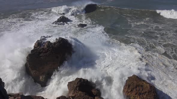 High Waves Breaking on the Rocks of the Coastline