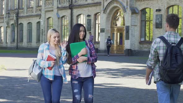 Female Students Walking Near University and Smiling to Men. Flirt. Slow-Motion