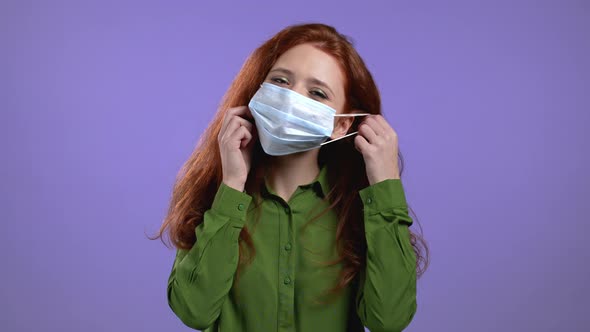 Pleased Woman Removed Protective Mask and Throws It on Floor As Symbol of Pandemic Epidemic End