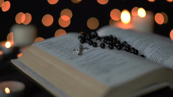 Cross And Bible With Bokeh Lights
