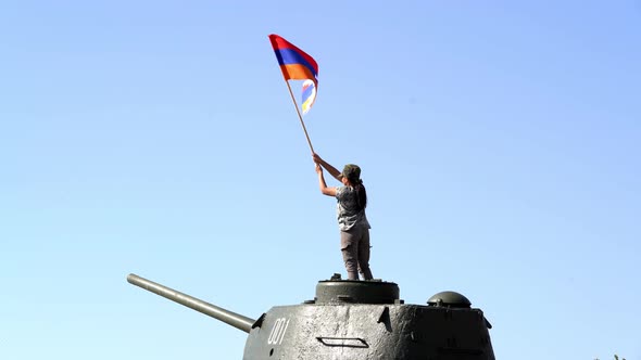  Little girl with Artsakh flag staying on the top of the tank. 