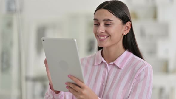 Young Latin Woman Using Digital Tablet