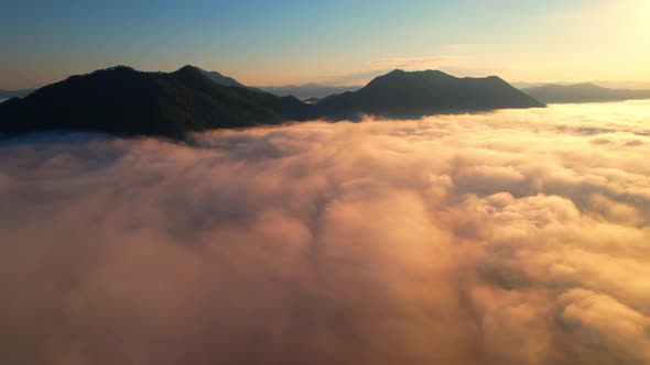 4K Sun is rising above sea of clouds until the horizon