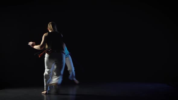 Two Women Are Performing Martial Art of Capoeira.
