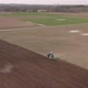 The Tractor Plows the Field Prepares for Crops - VideoHive Item for Sale