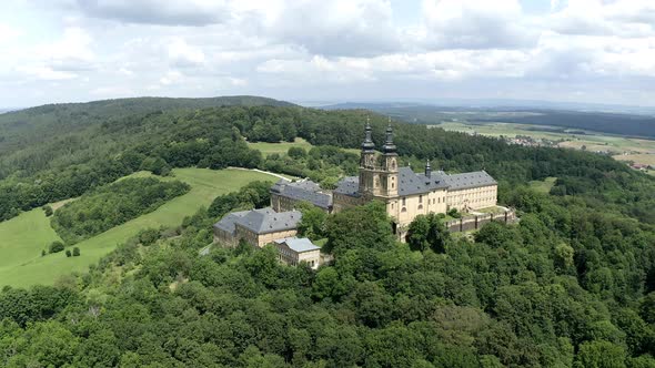 Banz Abbey on lush hill in summer, Upper Franconia, Germany
