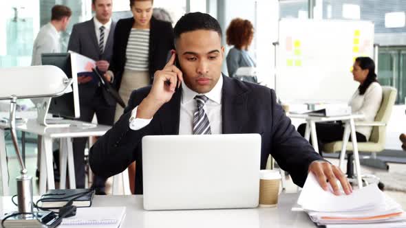 Businesspeople giving work to businessman