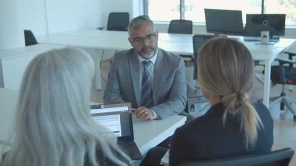 Serious Mature Male Candidate Meeting and Talking To Employers