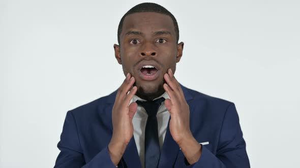 African Businessman with Shocked Expression, White Background