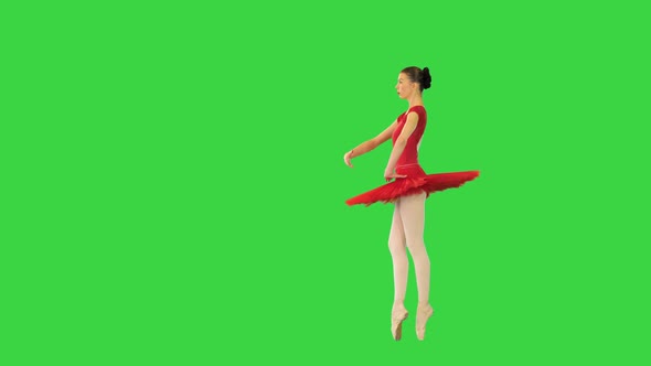 Young Ballerina in Red Classical Tutu Turns En Pointe and Makes a Reverence on a Green Screen Chroma